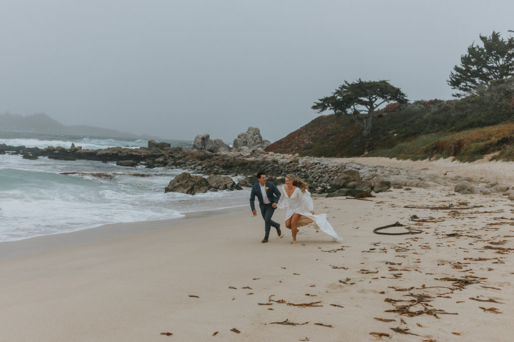 Who wouldn’t want to get married on the beach overlooking Monterey Bay, California while a hurricane is wrapping up?! Laura Minor Photography. From the retro van to running along the beach, this was a dream elopement.