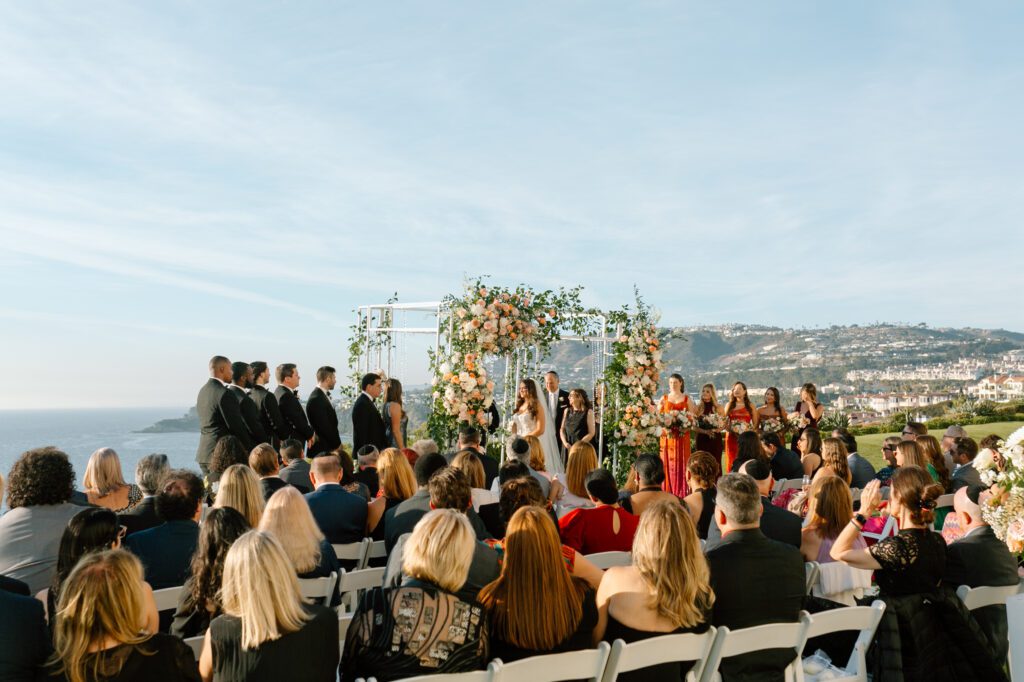 Southern California outdoor wedding ceremony overlooking the Pacific Ocean. Laura Burns Photography.