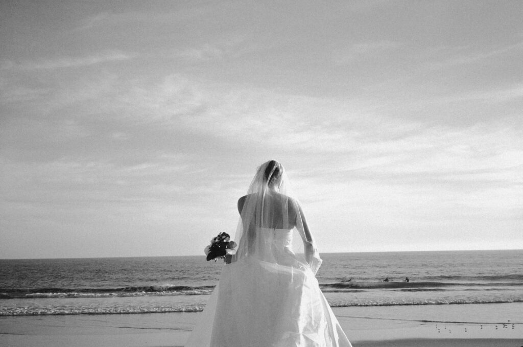 Newport Beach Wedding Photographer shooting a beach wedding on film and digital
